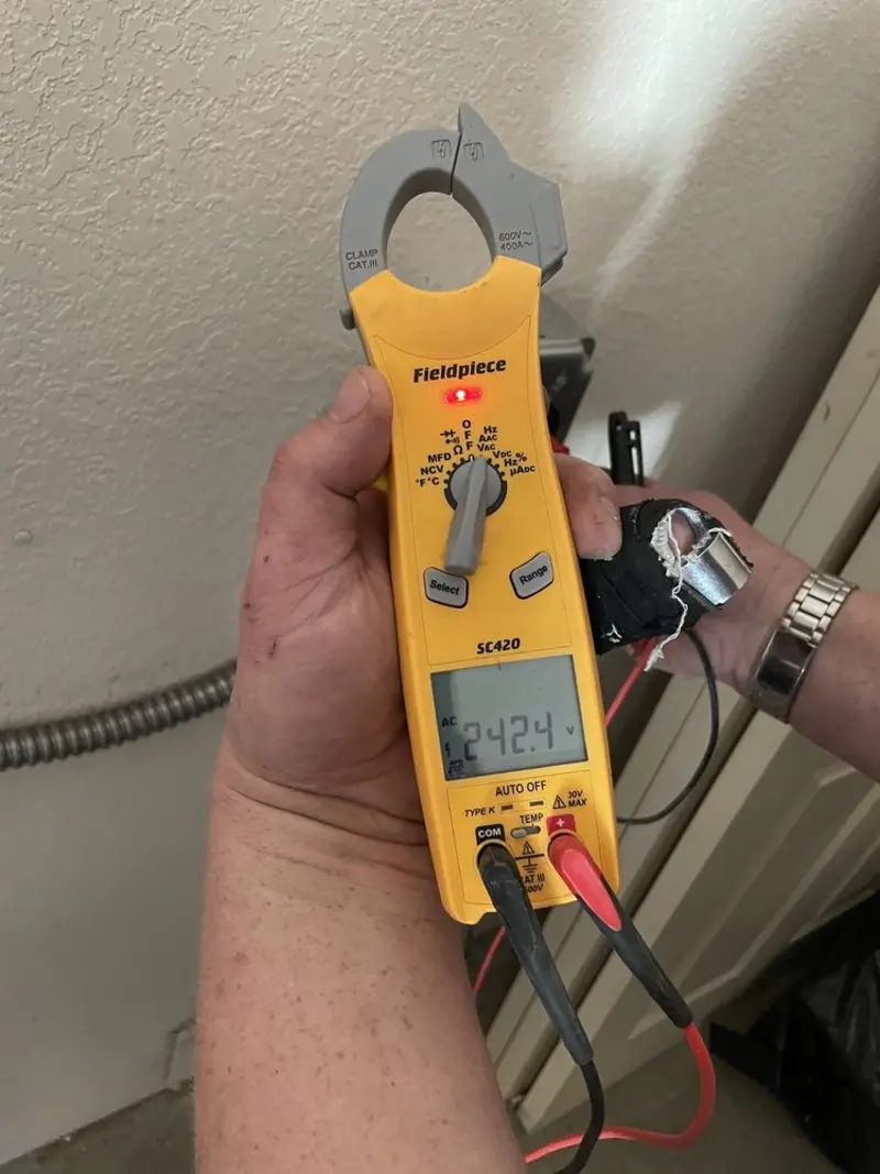 Voltage testing with clamp meter during Ceiling Fan Installation in Shelby